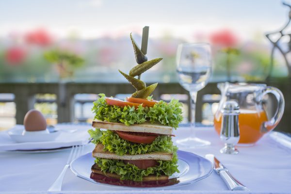 Aperitif on the terrace of our "1900" bar and full-day entrance to the indoor or outdoor pool for two people